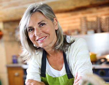 smiling woman wearing smock